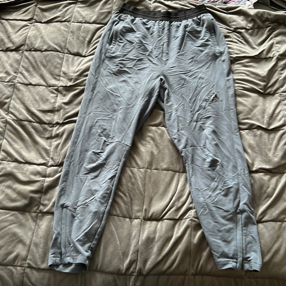 M blue Adidas joggers with zip leg